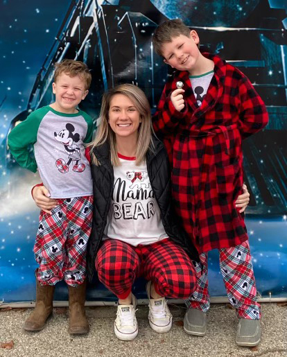 McEwen smiles with her sons for a family photo