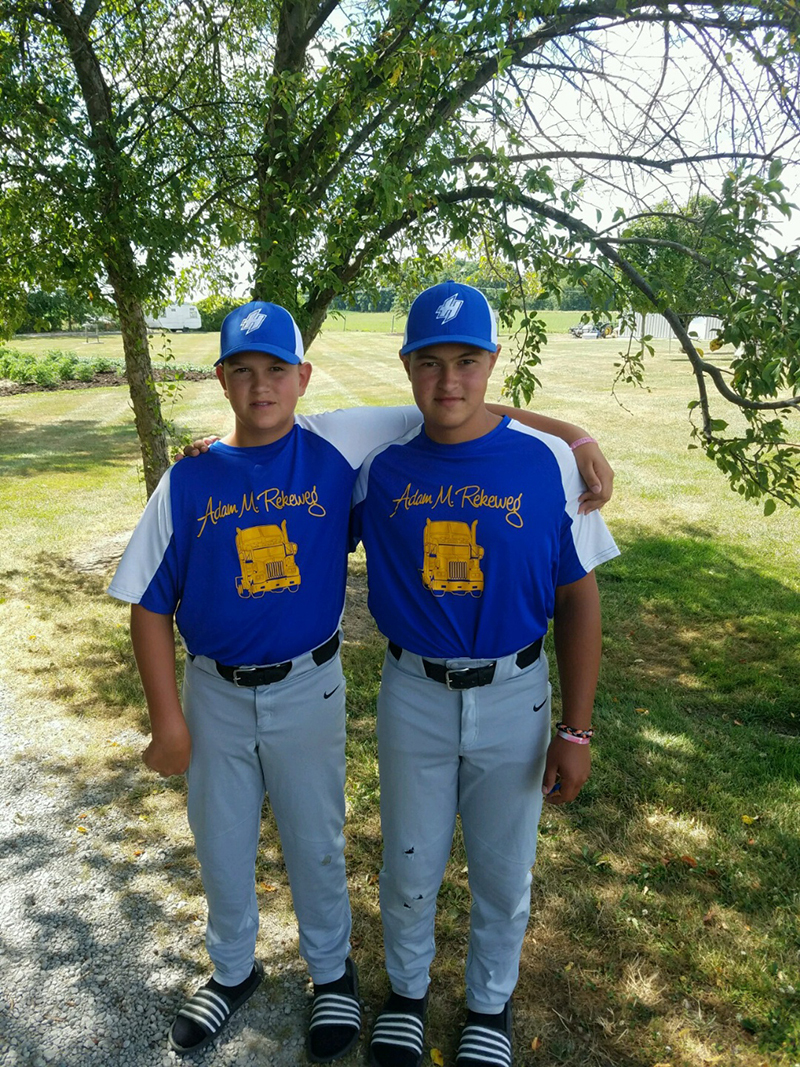 Britton and his brother in their baseball uniforms