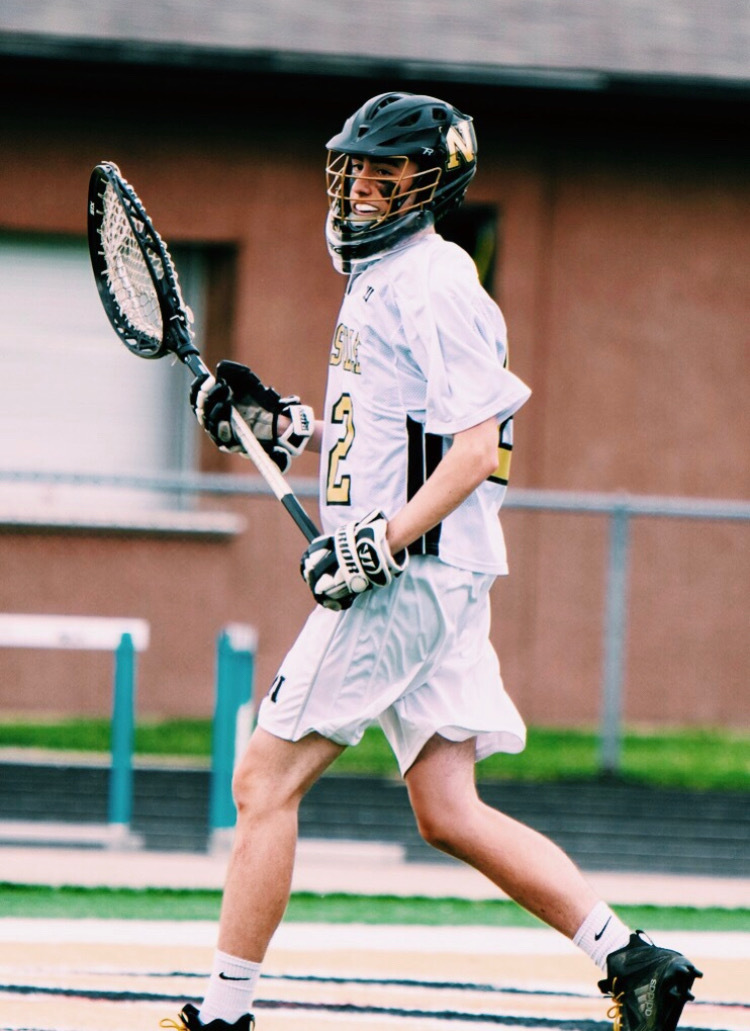 Griffin Smith playing lacrosse