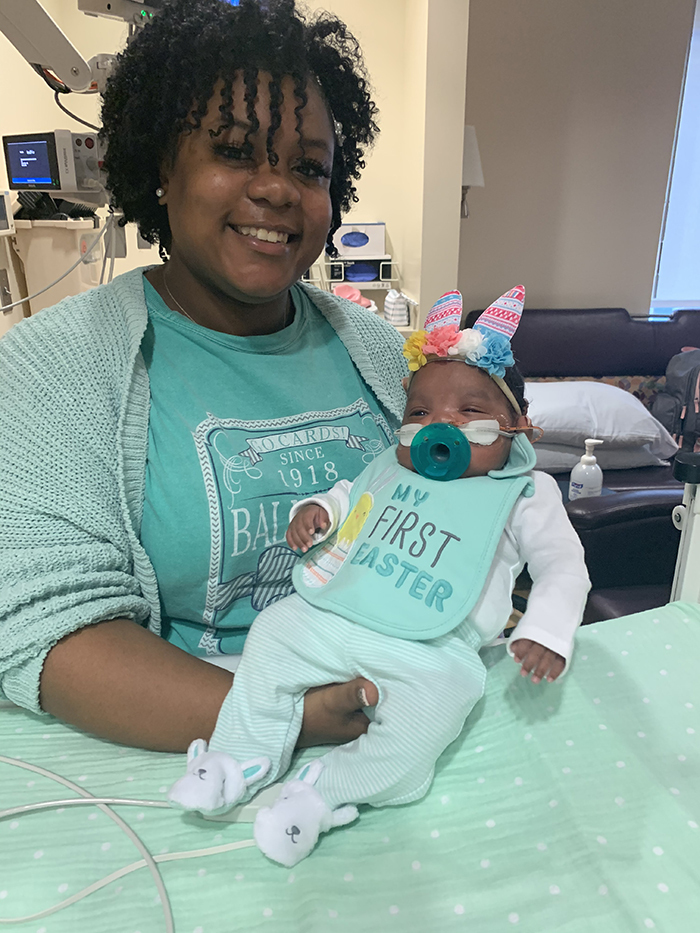 Tarissa holding her baby