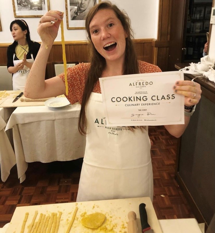 Fagan holds up a certificate from a cooking class