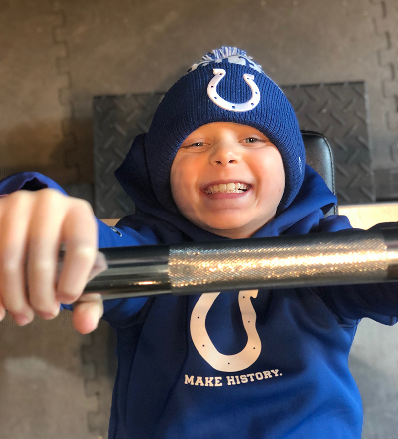 Mason decked out in Colts gear smiles for the camera