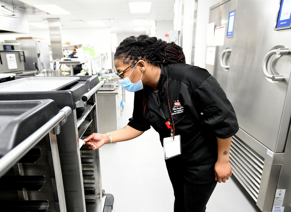 Thompson working in the kitchen