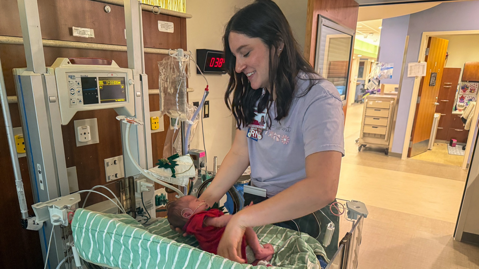 nurse dressing baby
