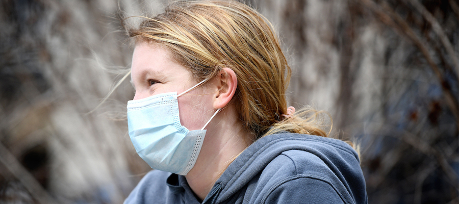 Kendall Eberly smiles under face mask