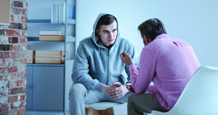 teen talking with counselor