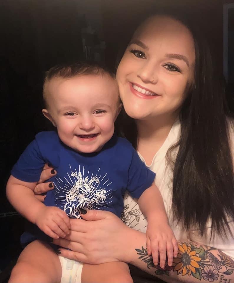 Dorie and Josiah smile towards the camera