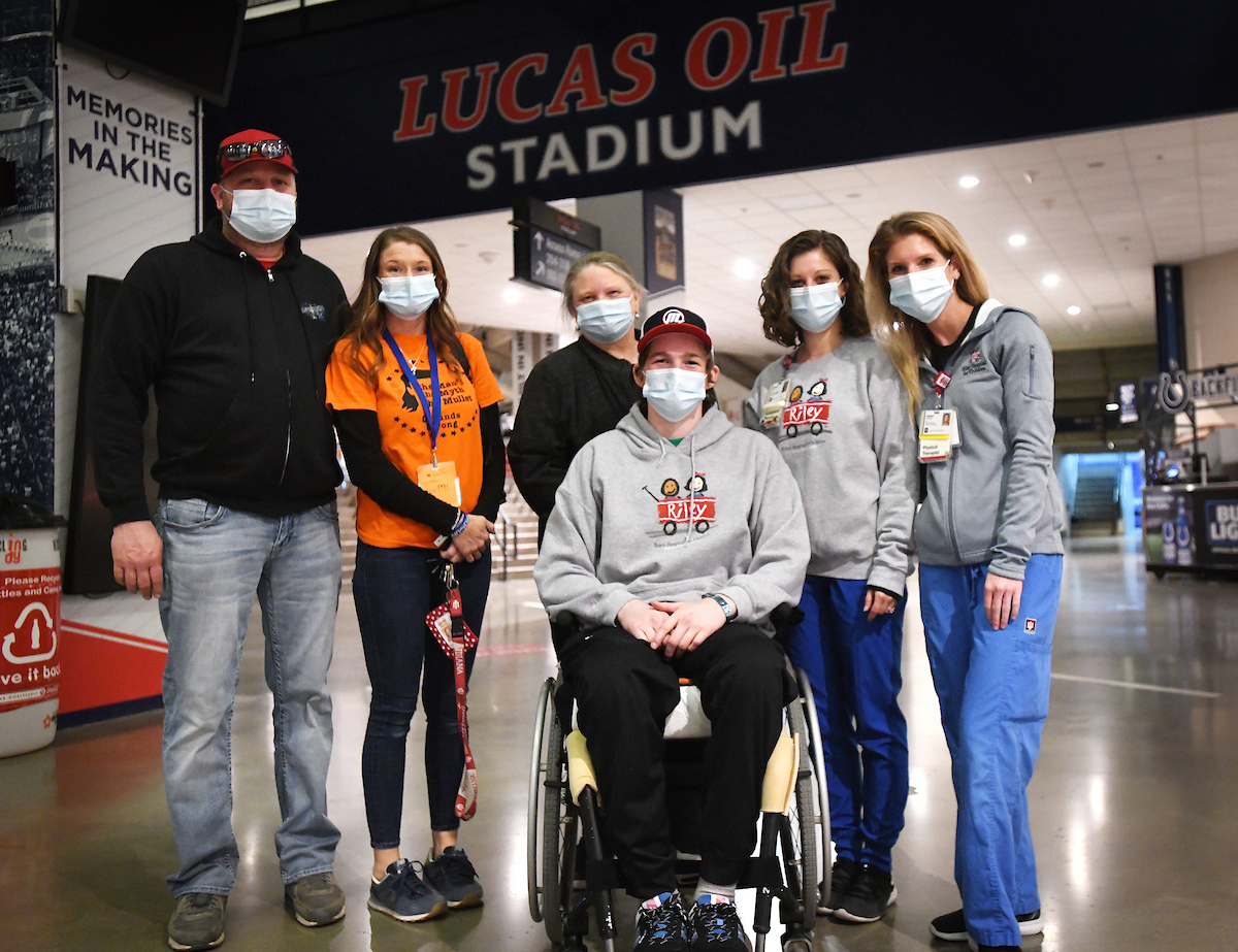 Lucas, his family, and his Riley support team at Lucas Oil