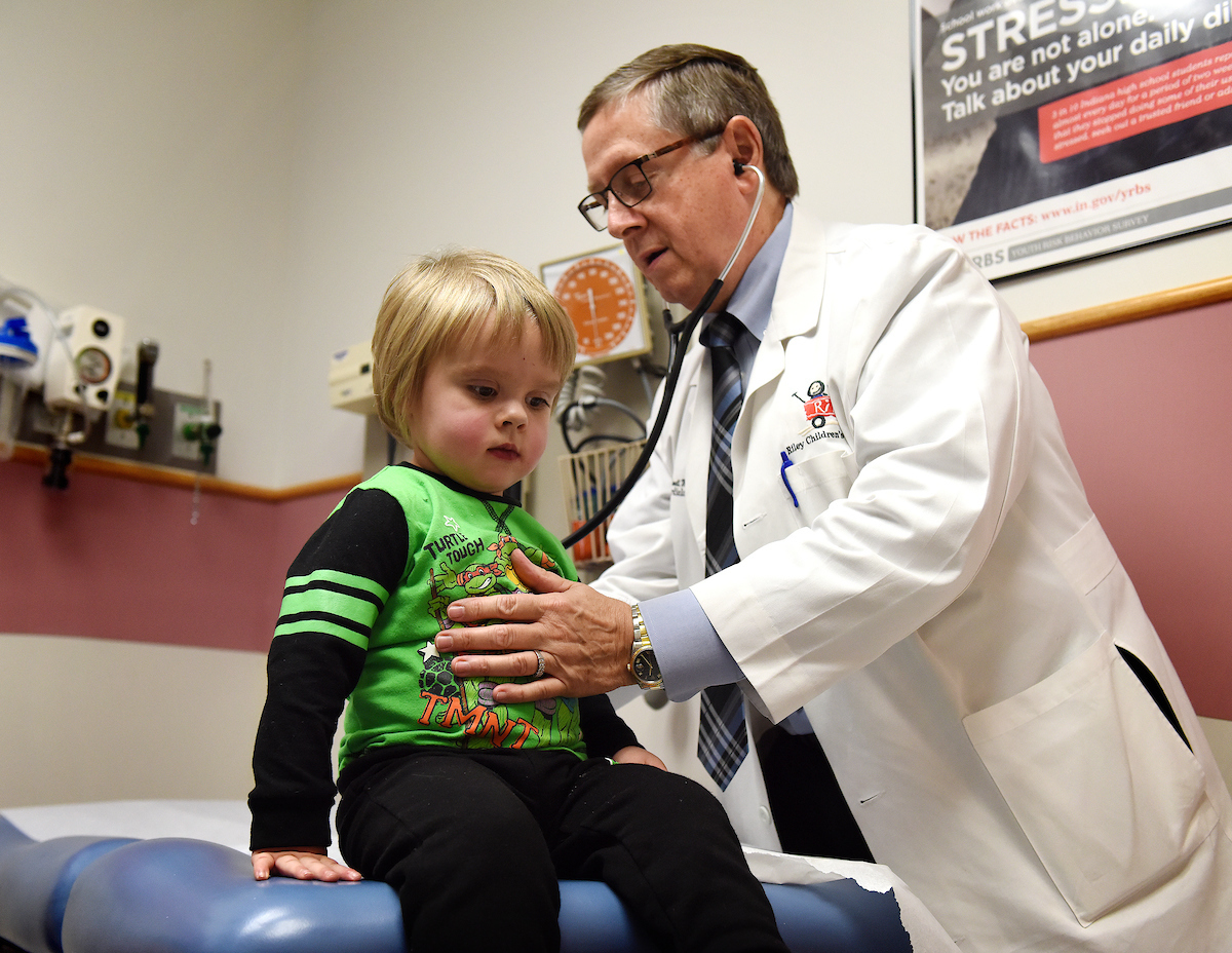 Dr. Caldwell uses his stethoscope