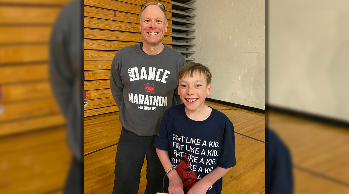 Lane Veach with his dad in the school gym