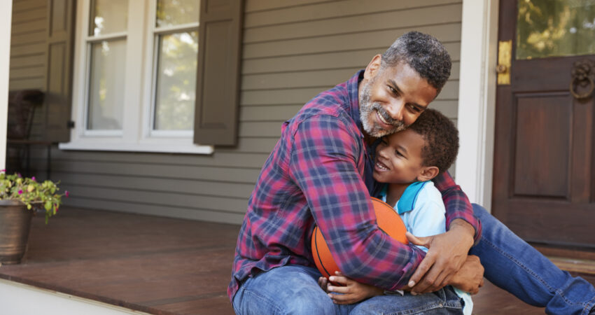 dad and son hugging